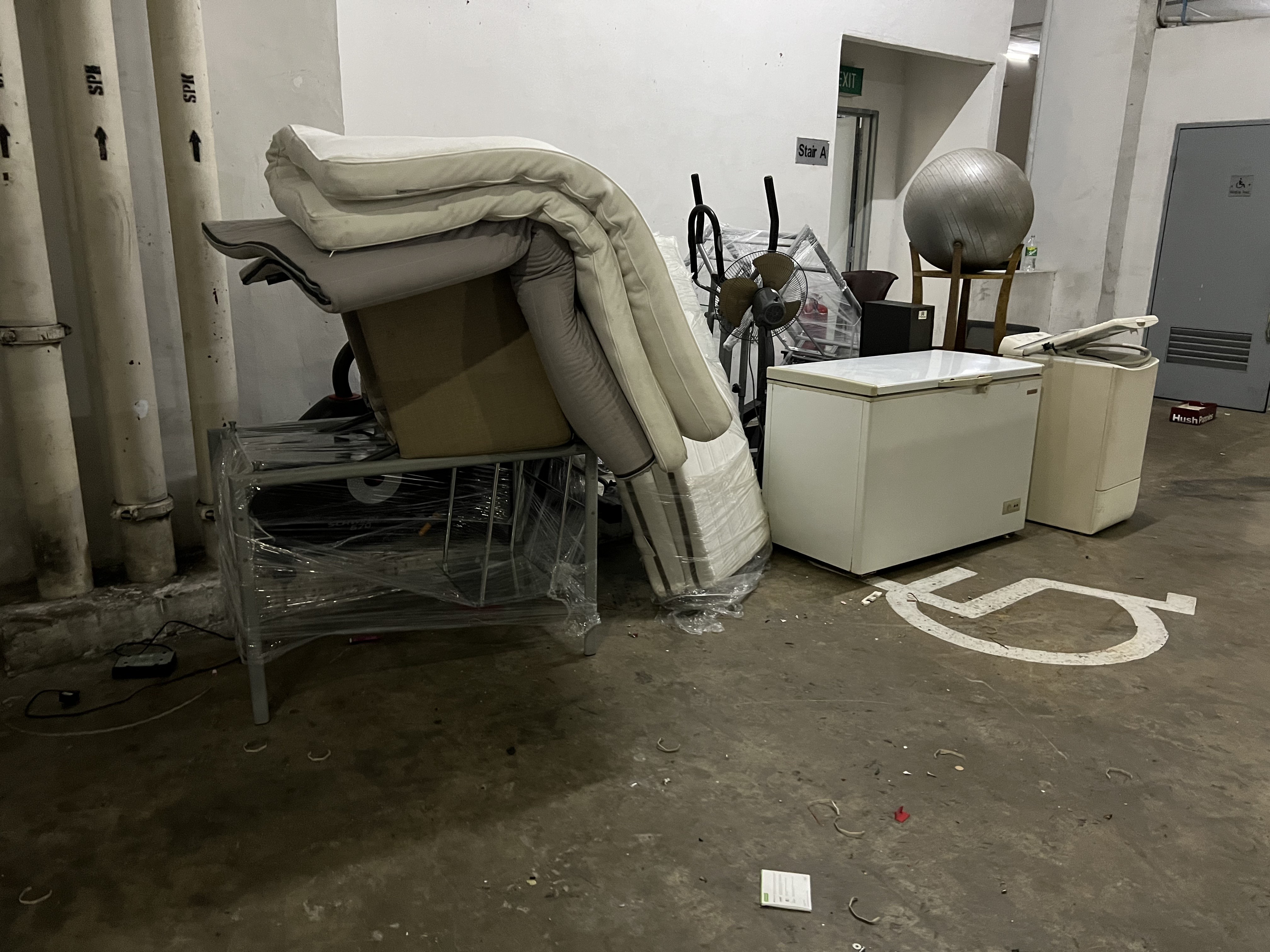 Bulky waste including mattresses and appliances cleared from a car park in Clementi.