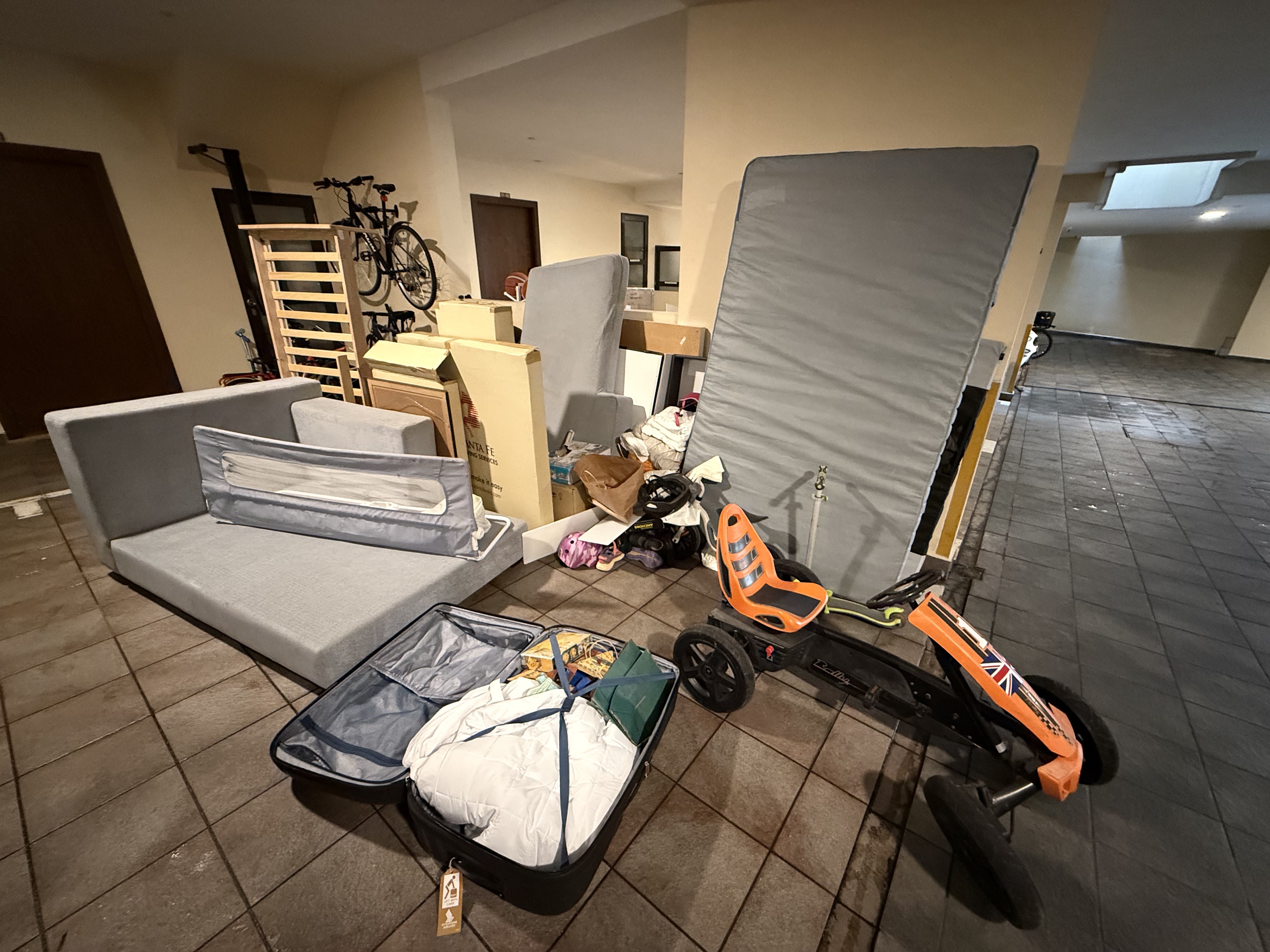 Disposal of bulky furniture and toys from a Ulu Pandan residential area, including a sofa and pedal car.