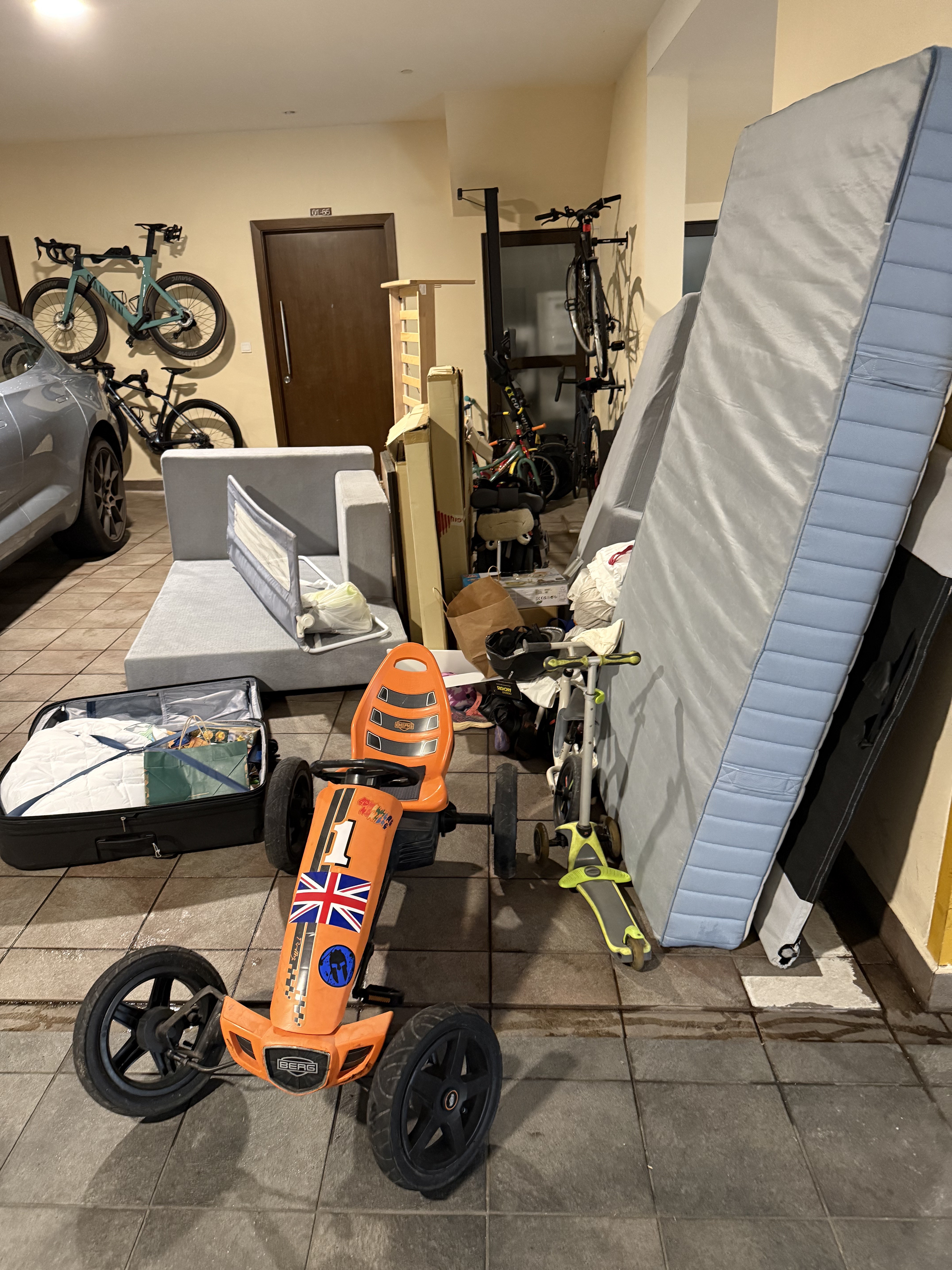 Removal of old furniture and a pedal car from a Ulu Pandan car park. Items cleared include a sofa, mattress, and pedal car.