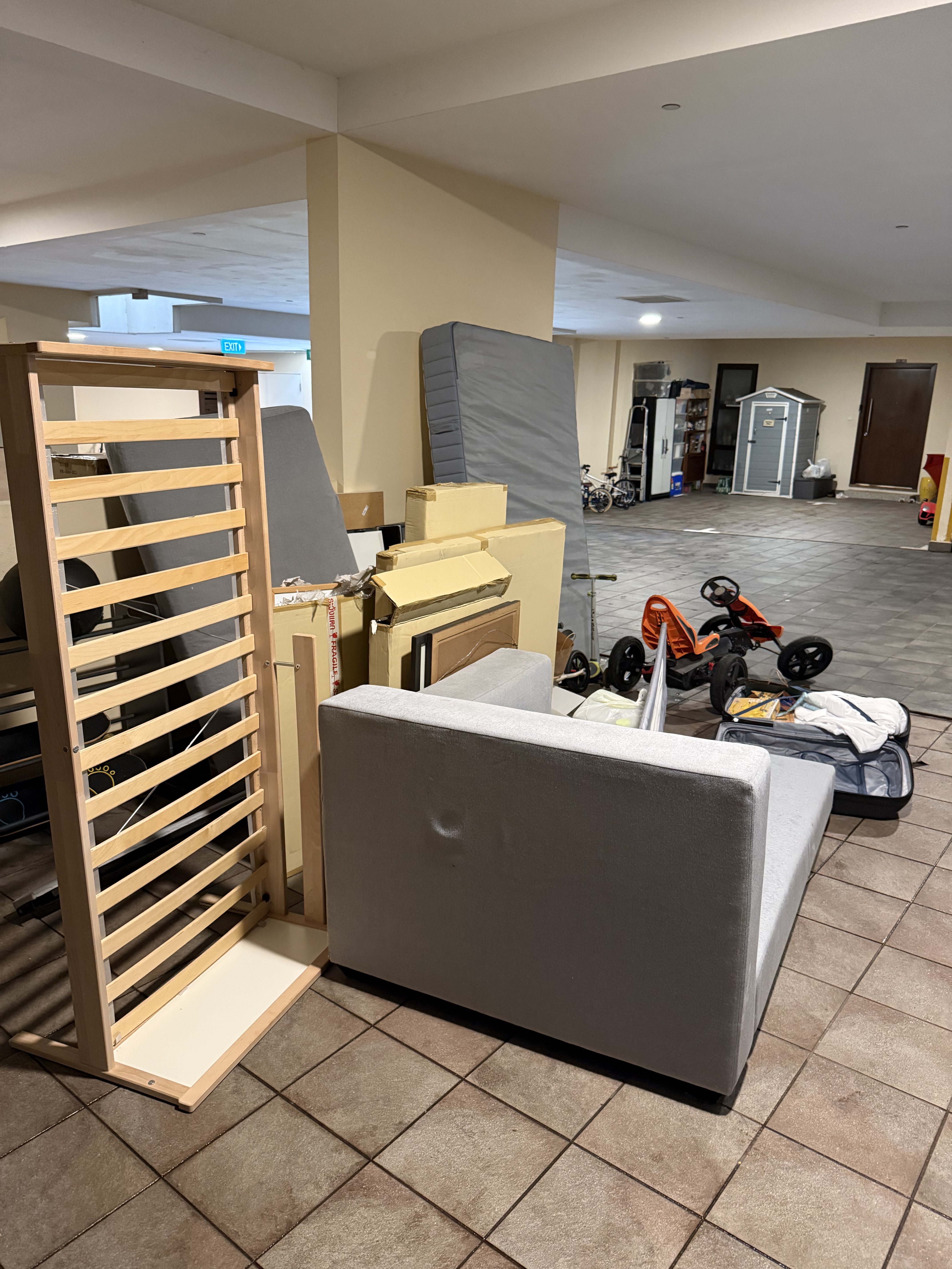 Removal of furniture and mattresses from a Ulu Pandan car park for disposal.