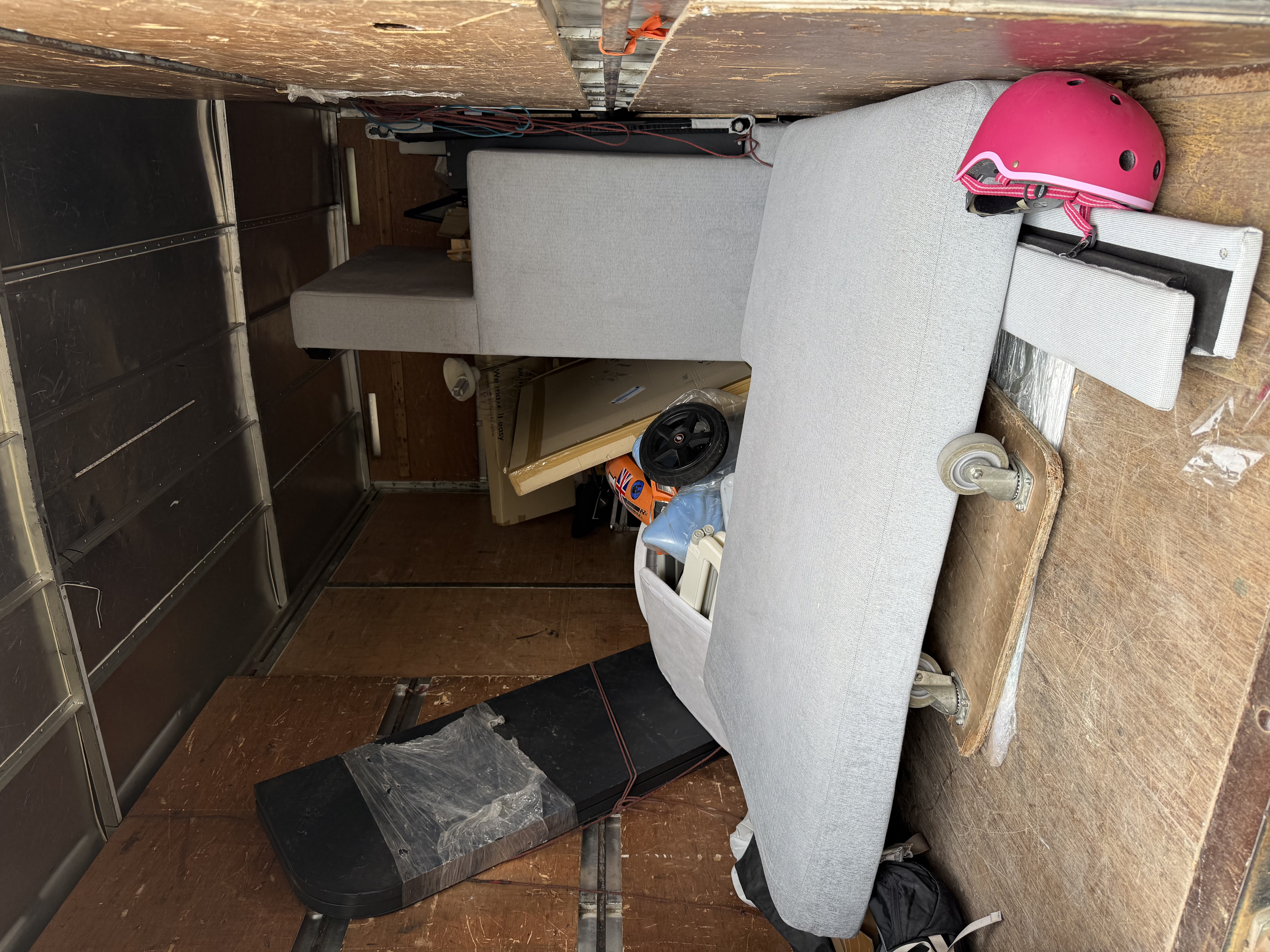 Sofa, mattress base, and small items loaded into the truck after the Holland Village pickup.
