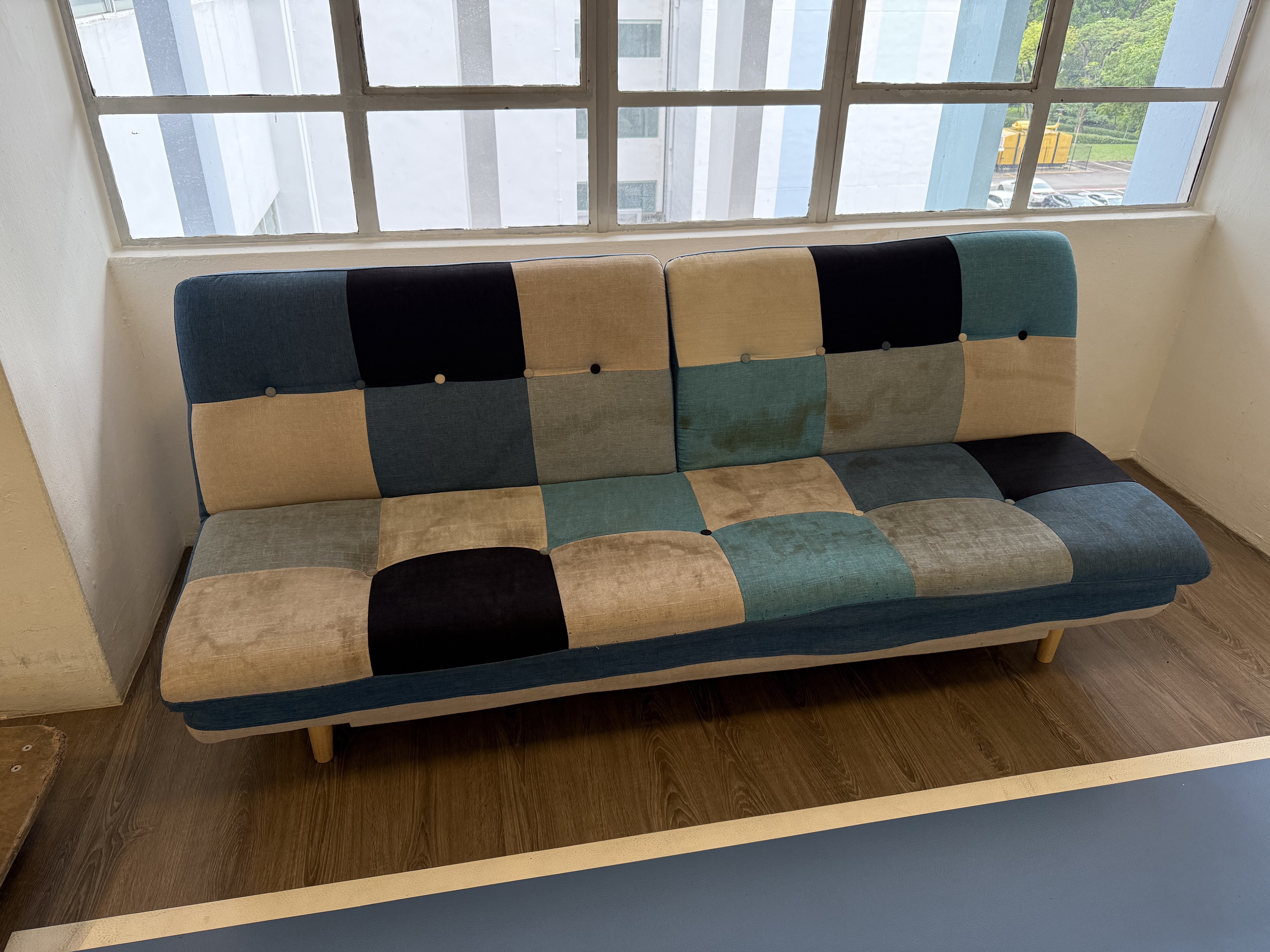 Patchwork sofa removed from a residential property in Queenstown, Singapore.
