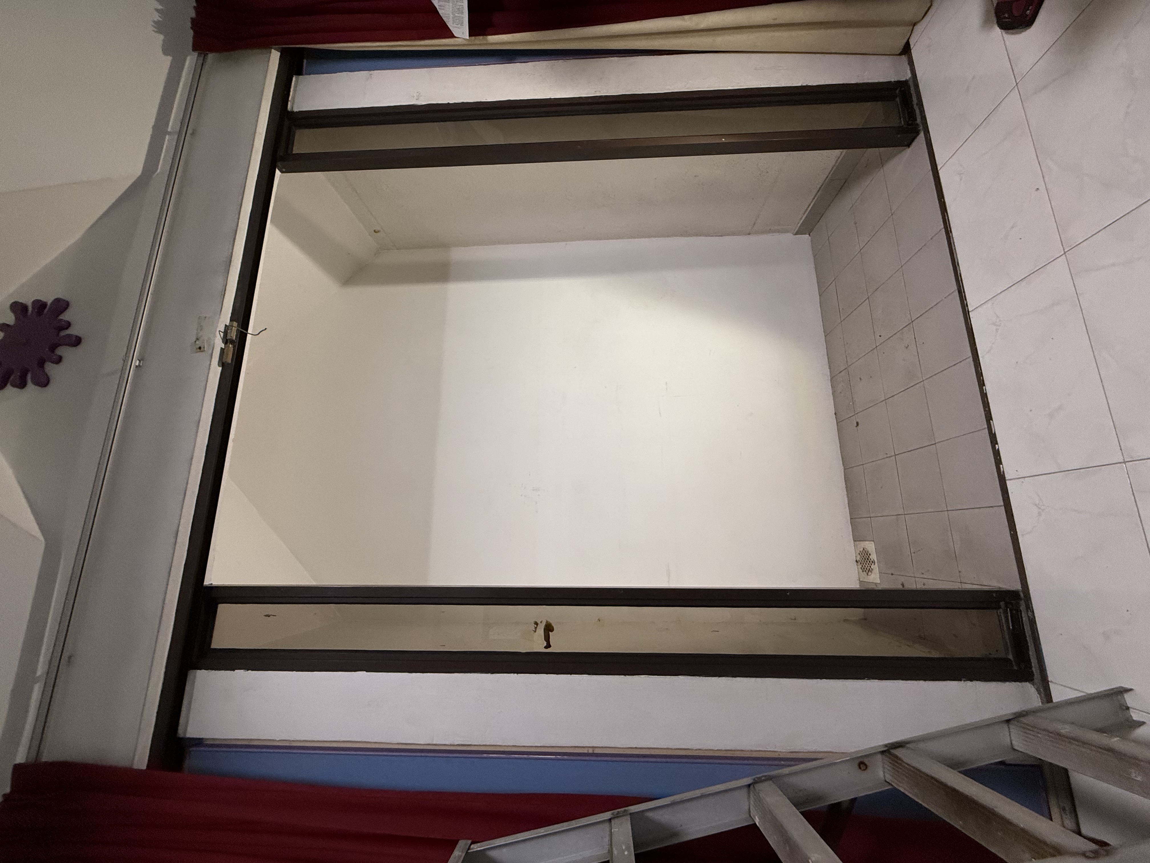 Interior partition wall in a Pasir Panjang landed-property unit, cleared and ready for renovation work.