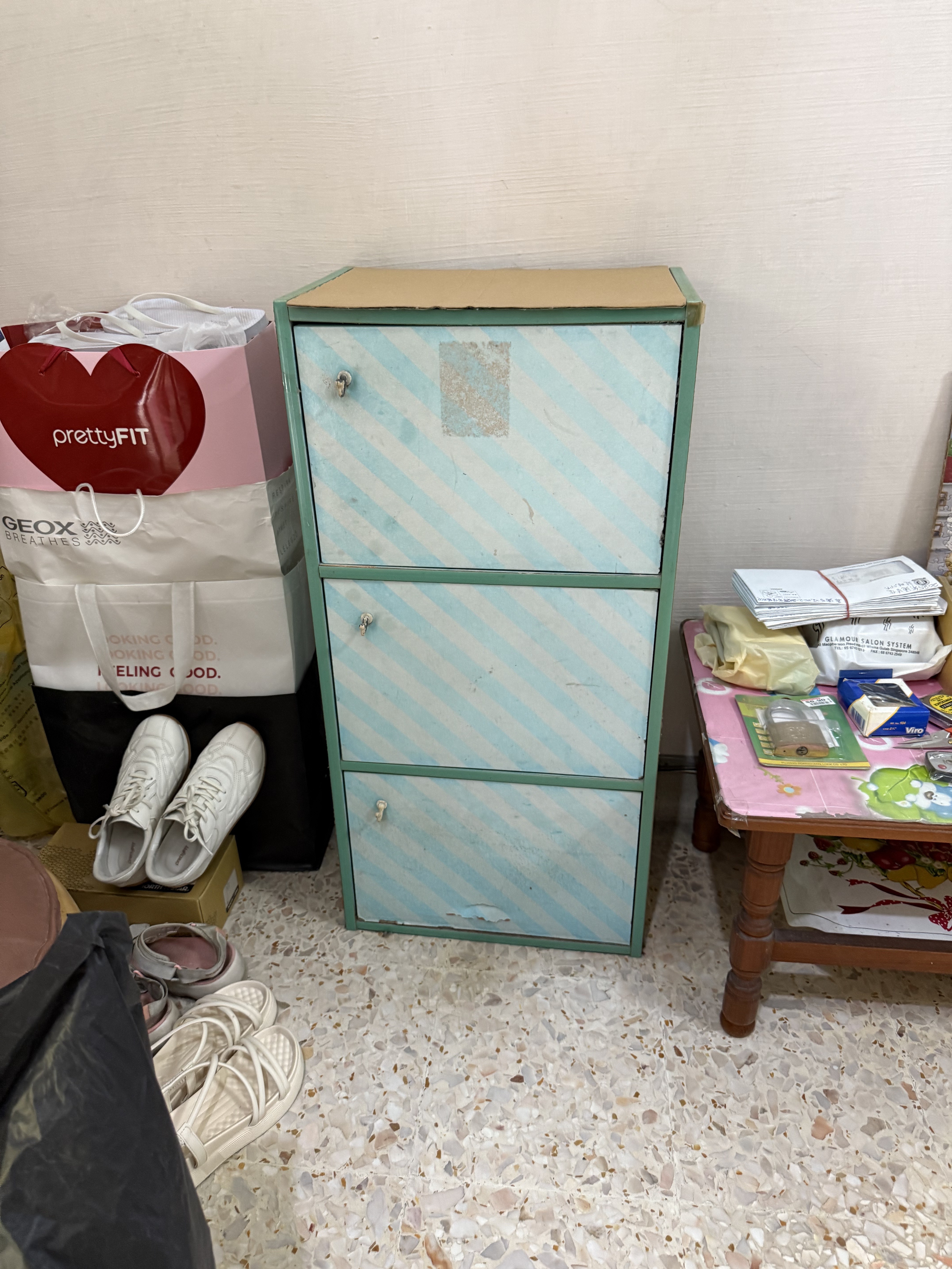 Junk items including bags and shoes, cleared from a residential space in Ang Mo Kio.