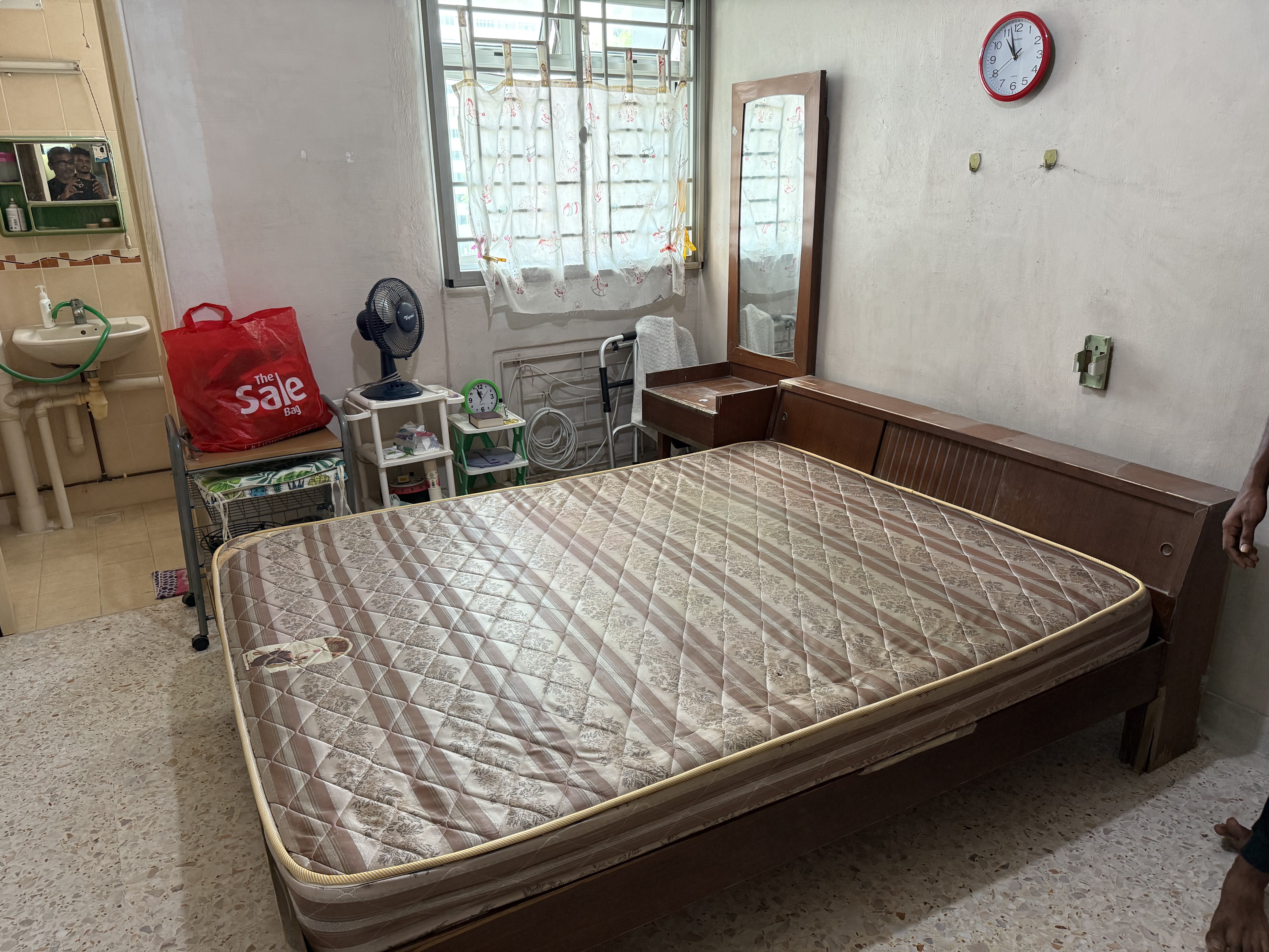 Mattress and bed frame ready for clearance from an HDB bedroom — exactly the kind of bulky piece that shouldn't end up dumped at the void deck overnight.