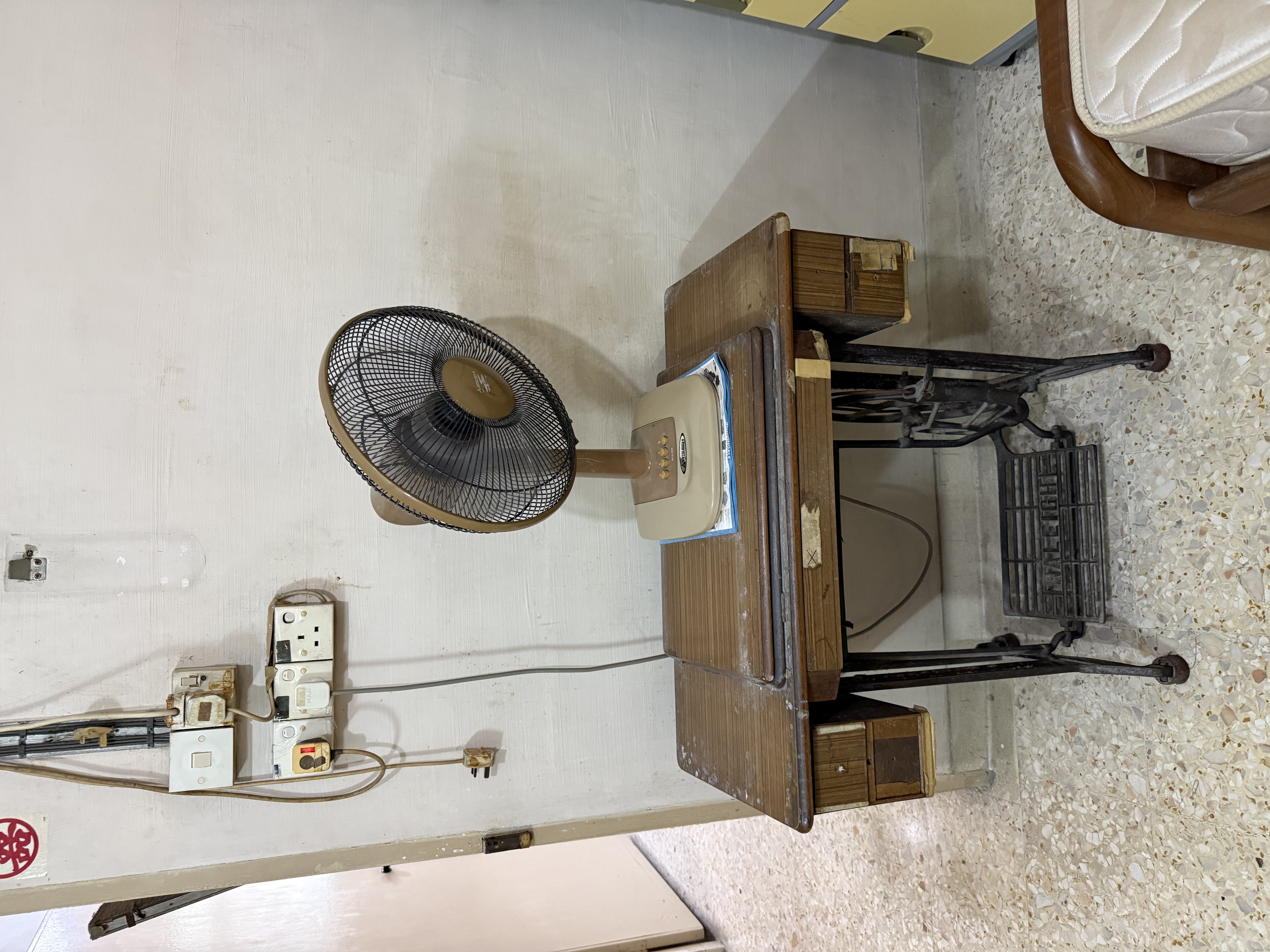 Old sewing machine table and fan cleared from a residential property in Ang Mo Kio.