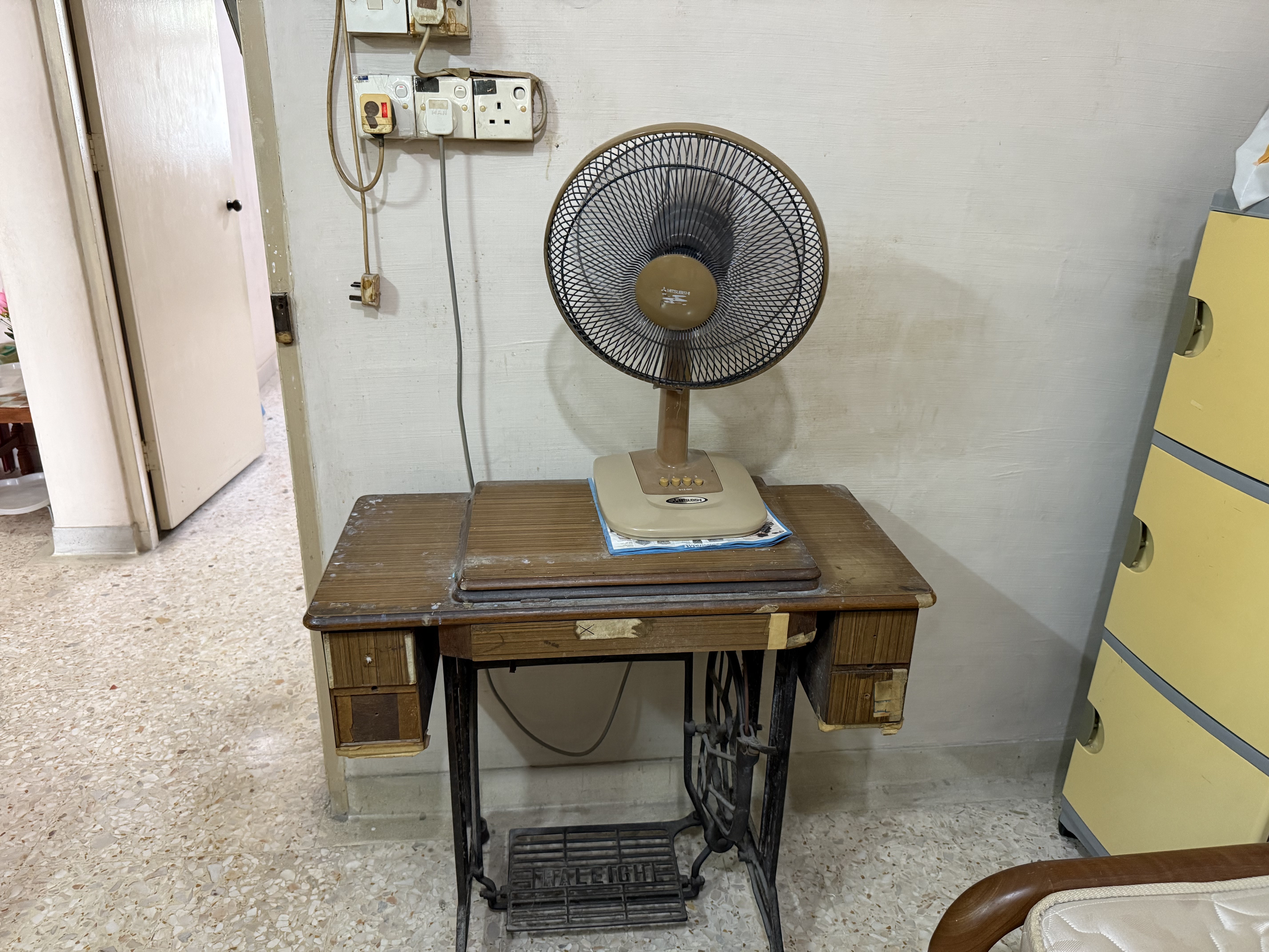 Old sewing machine and fan removed from a cluttered home in Ang Mo Kio.