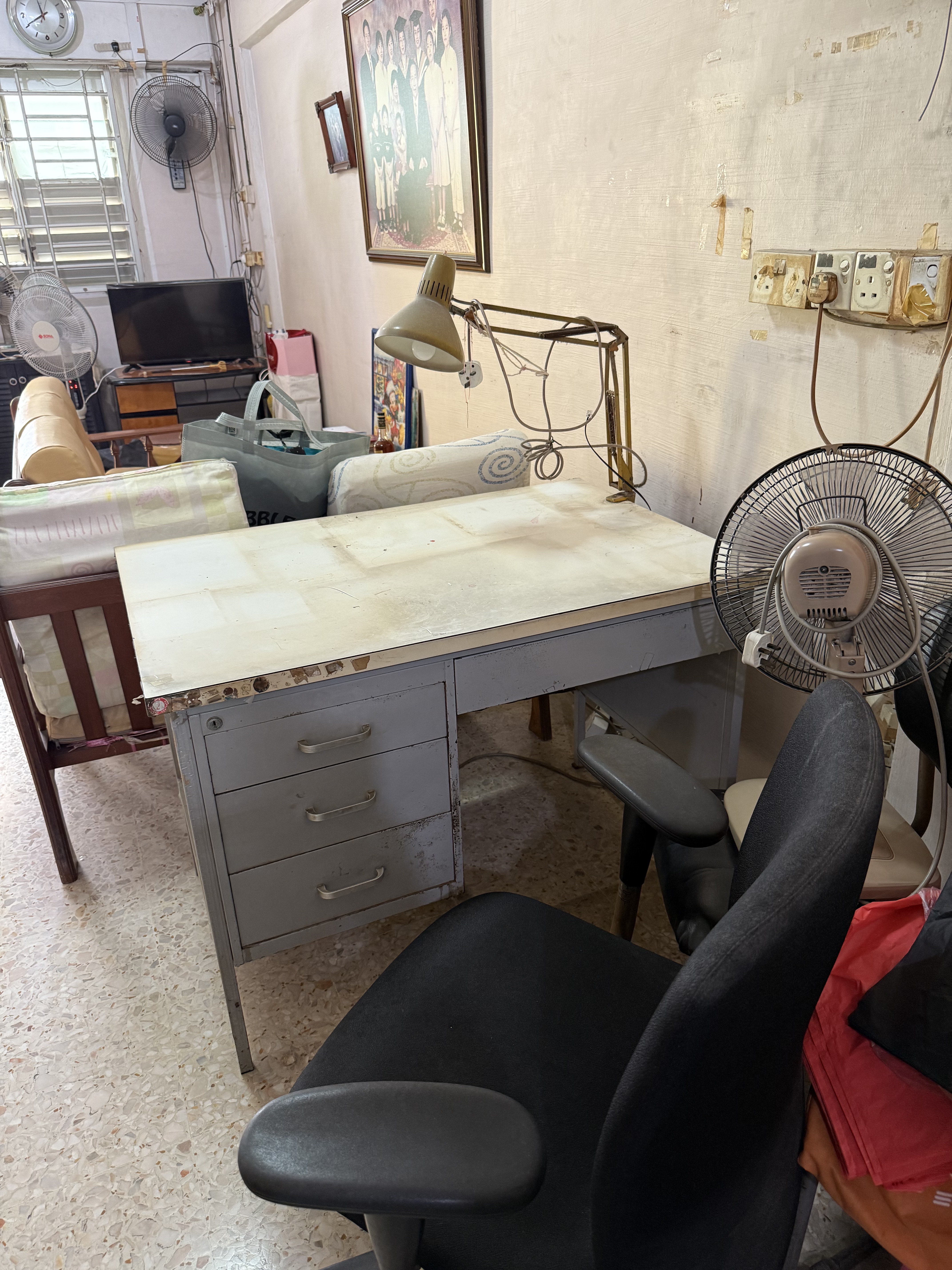 Disposing of a vintage metal desk and office chair from a residential unit in Ang Mo Kio.