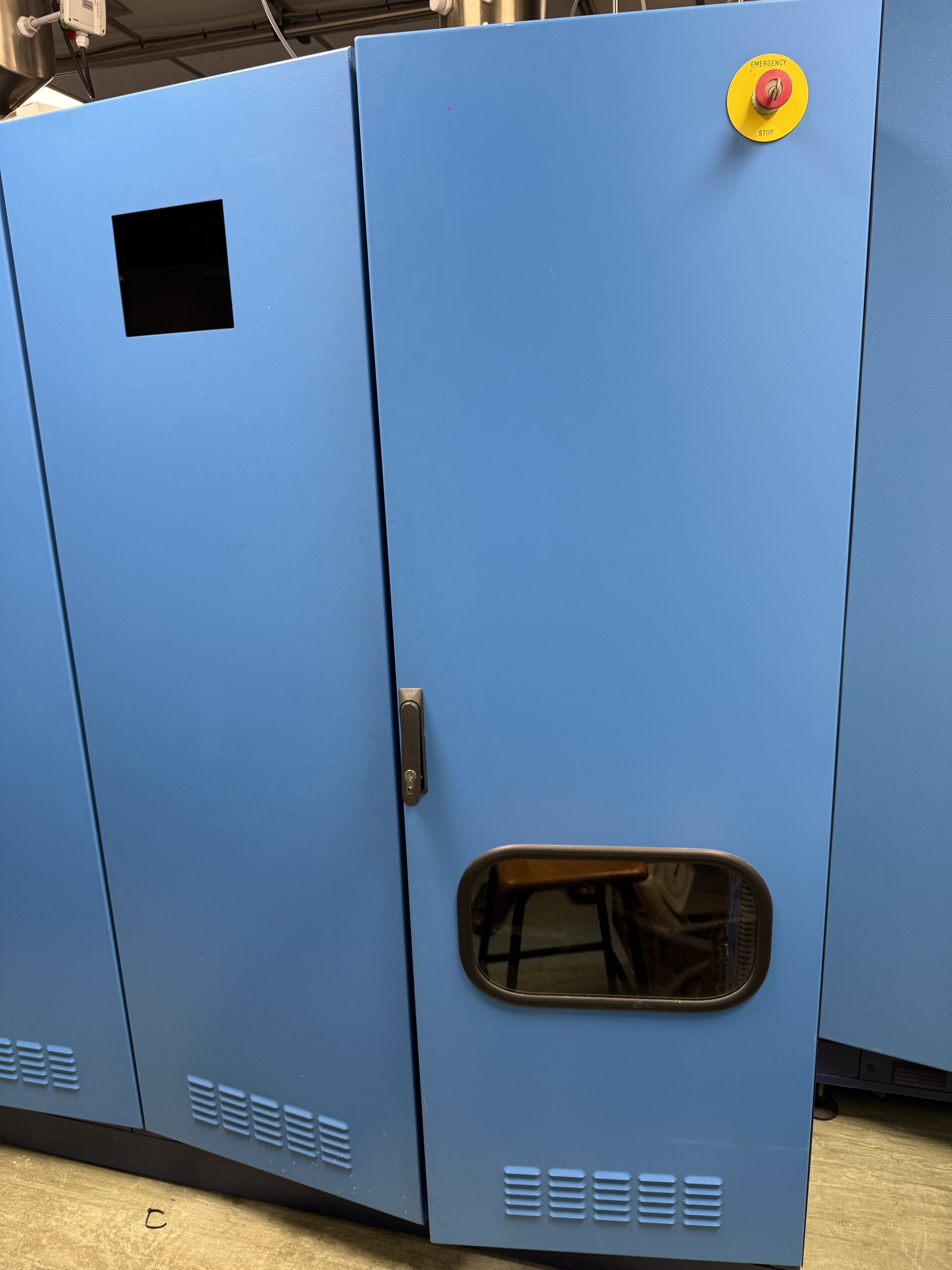 Before: storage racks and lab cabinets in the photonics lab.