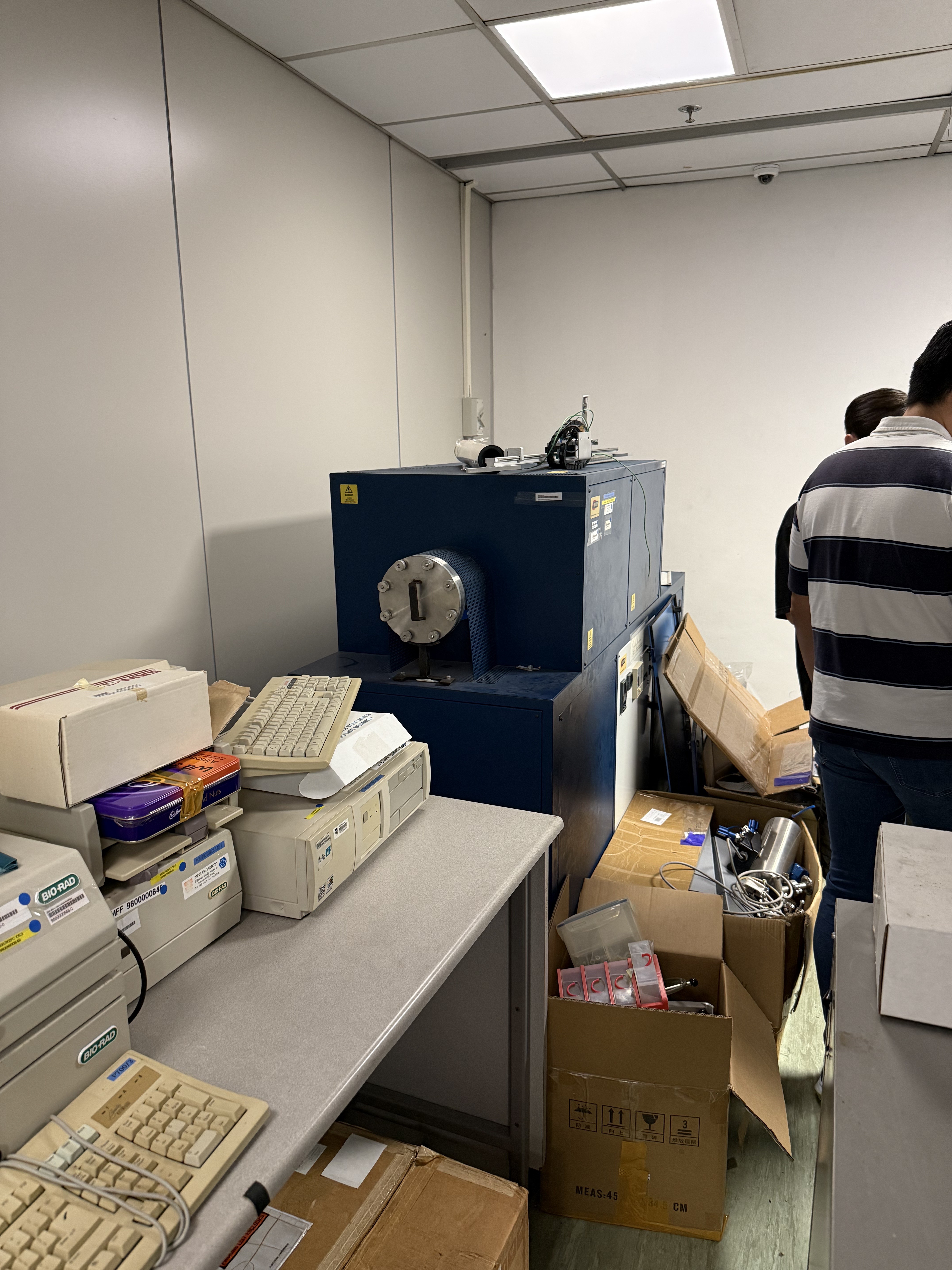 Before: old computers and lab equipment ready to be cleared.